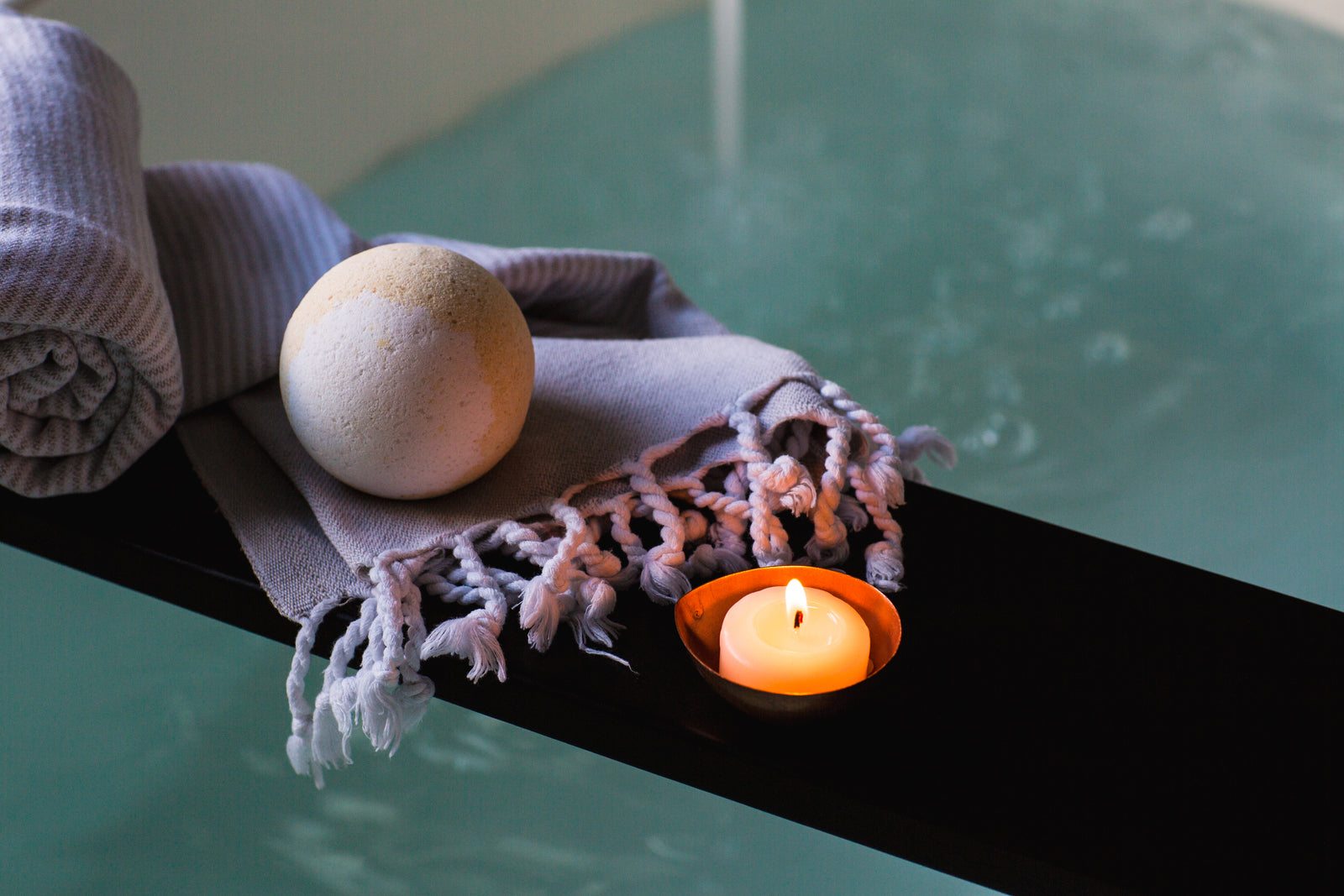 A candlelit bath prepared for a slow evening