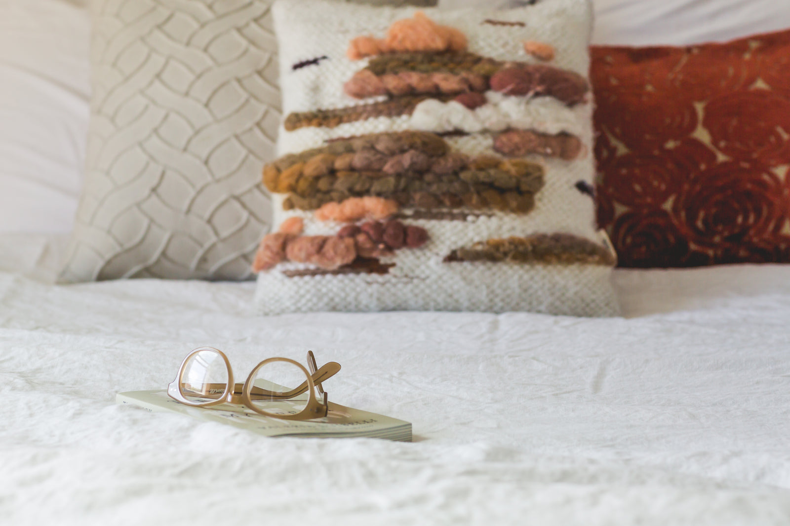 A calm bedroom with soft bedding
